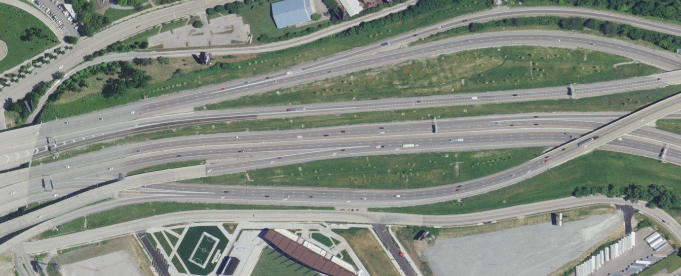 Aerial photograph of an interstate interchange in Louisville, Kentucky, with individual cars and trucks visible on every lane